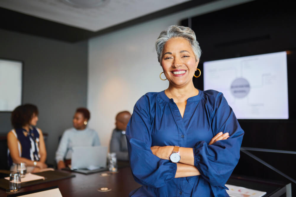 A female CEO is setting high ethical expectations during a meeting. Clear values not only guide you—they inspire trust in everyone around you.