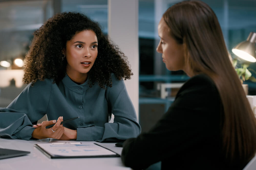 A senior team leader is encouraging a manager to step up. Believing in someone’s potential often gives them the courage to rise to it.