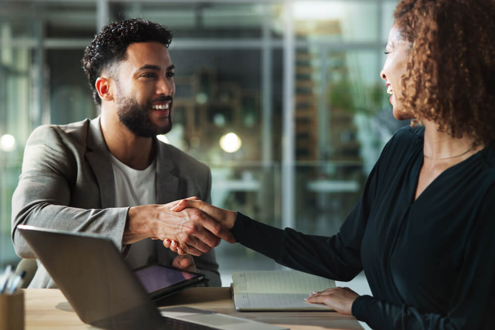 A senior leader is onboarding a new team member and making her feel welcome. Trust is built conversation by conversation, long before the pitch.