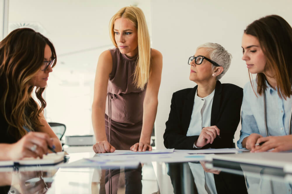 A VP is trying to get buy-in from her key stakeholders during a meeting. Influence grows when you bring people with you, not when you pull rank.