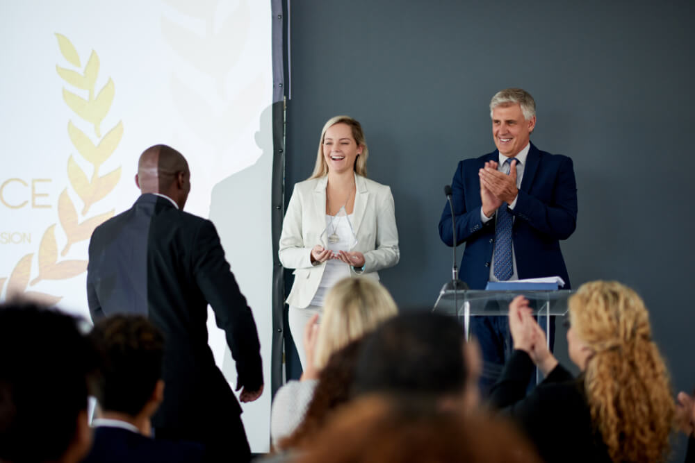 An executive team is rewarding a leader for his extraordinary efforts. Recognizing integrity reinforces its value within your organization.
