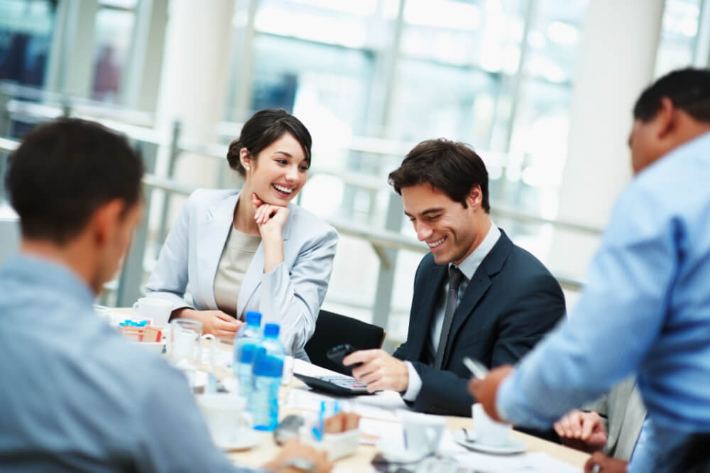 Leaders are collaborating on an important organizational milestone. Great milestones are reached when leaders inspire collaboration, not just compliance.