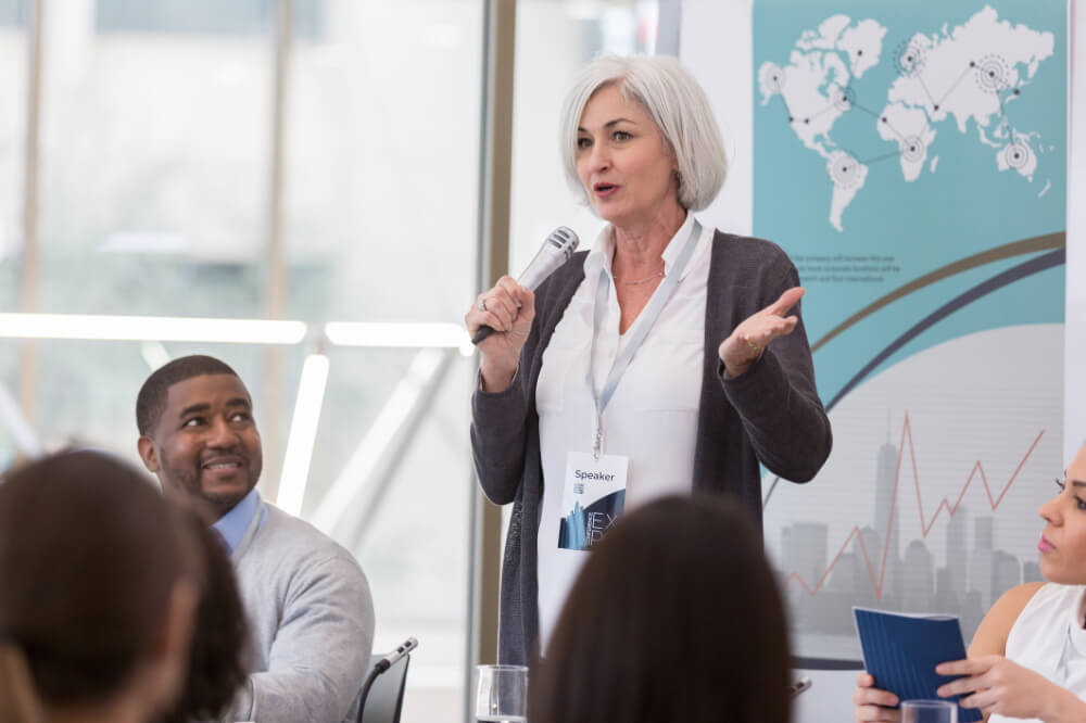 A CMO is leveraging her understanding of persuasion during a presentation. Presenting with persuasion means connecting ideas to what truly matters to others.