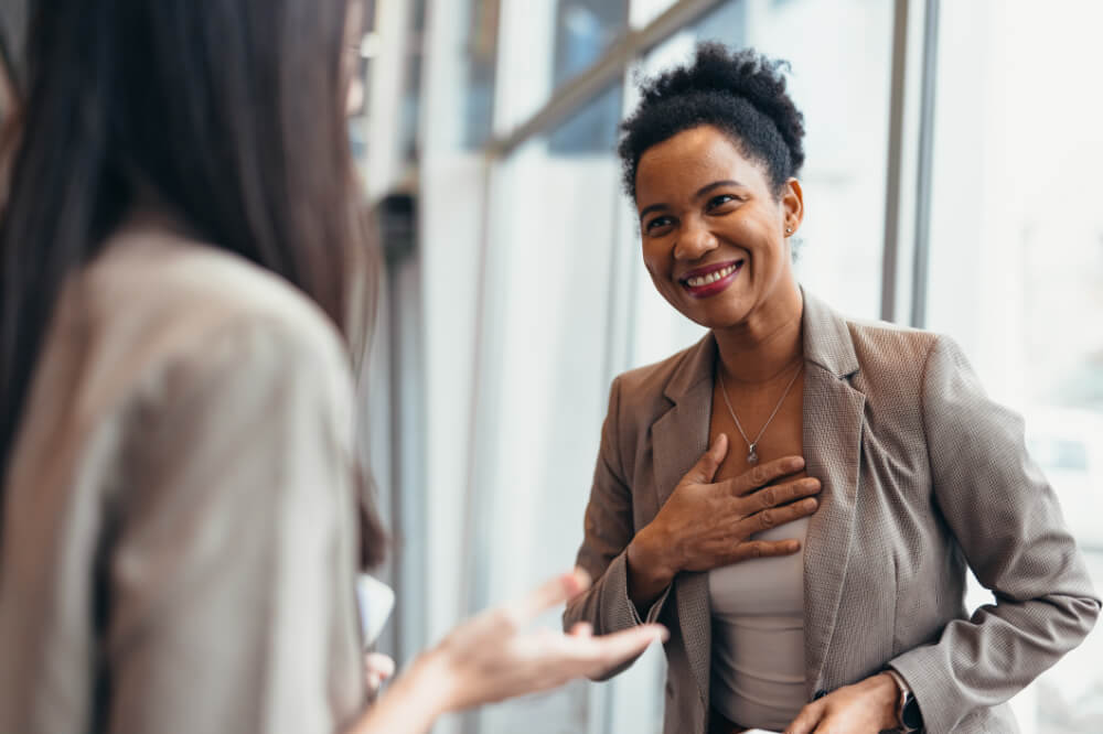 A leader is sharing a personal story with a team member. Your stories don’t need to be grand—they just need to be real.