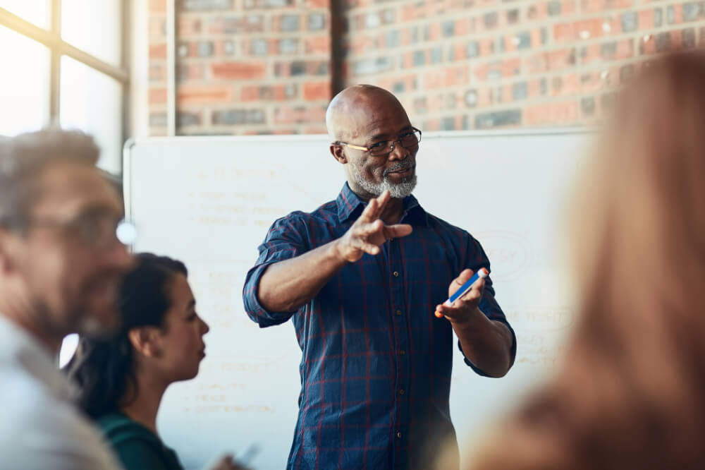 An executive is showing his passion for the company’s new product by sharing a powerful story. The story that connects is often the one that shows genuine excitement.