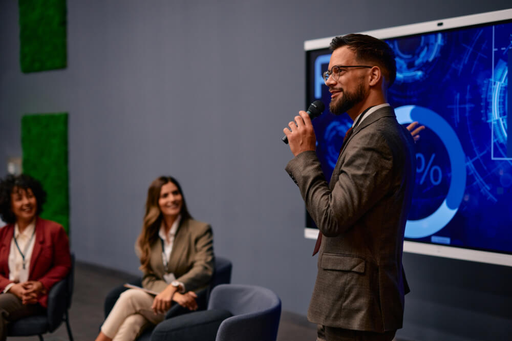 An executive member is presenting with charisma. Executive presence grows when your stories are clear, intentional, and purposeful.