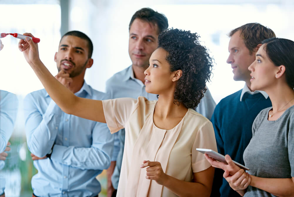 A cross-functional team is defining who is responsible for what. When responsibilities are shared, clarity ensures no task falls through the cracks.