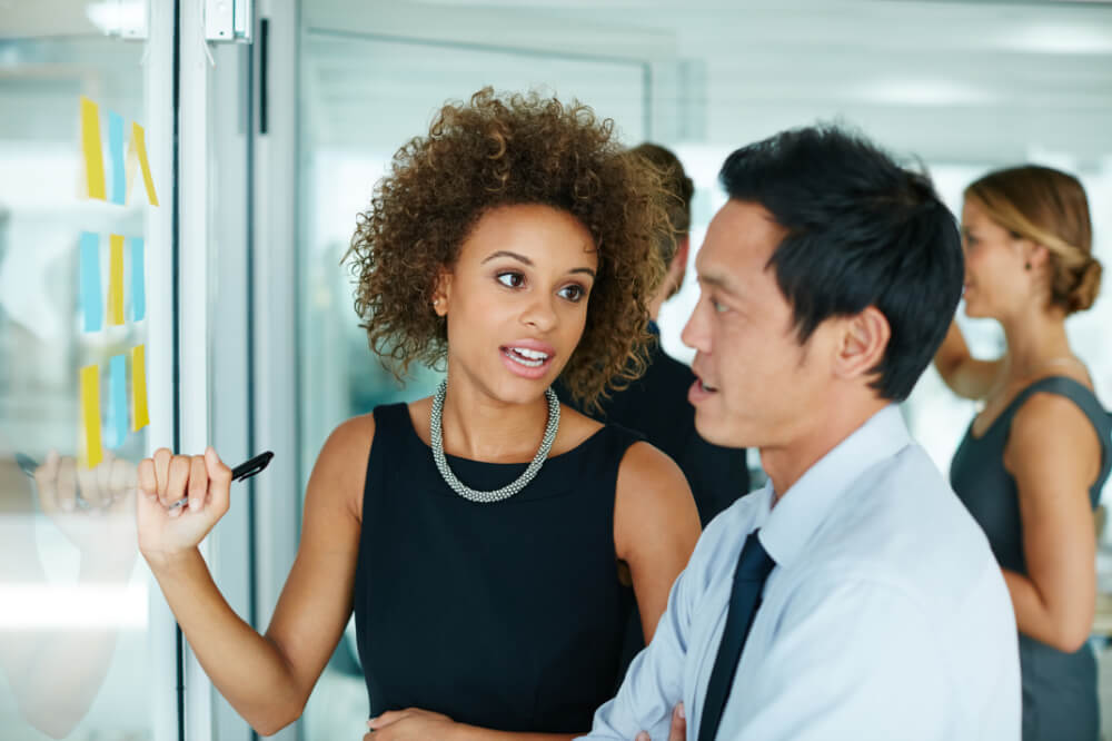 A team lead is making sure that everyone understands their roles and responsibilities. Clarifying roles upfront avoids the costly delays of mid-project confusion.